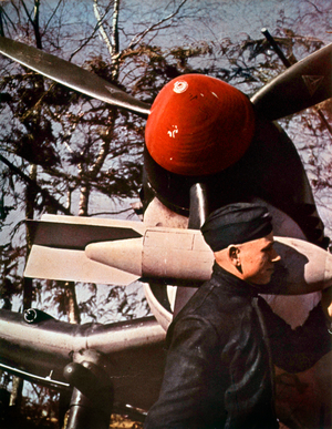 Soldier holding a light bomb for armament of Stukas (german bombers), may 15, 1940
