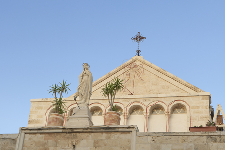 Statue of St Catherine at the entrance to the Church of St Catherine, Bethlehem, Palestine (photo)