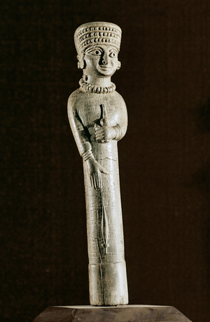 A woman spinning, with distaff and spindle