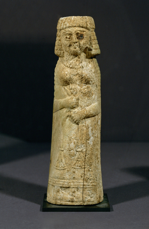 Woman holding a lotus flower. Phoenicia, Persian period (bone)