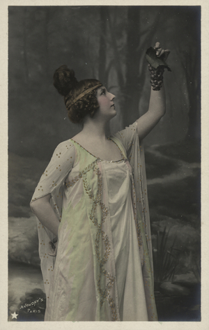 Woman with bunch of grapes (colour photo)
