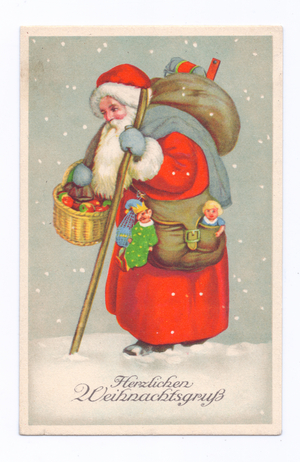 Edwardian postcard of Father Christmas with a sack on his back and a basket of fruit on his arm walking through the snow, c.1910 (colour litho)