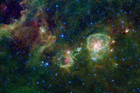 Sprawling across the constellation Vela is a complex of dark, dense clouds of dust and gas. The complex is called the Vela Molecular Cloud Ridge. This ridge may form part of the edge of the Orion spiral arm spur in our Milky Way galaxy. WISE.