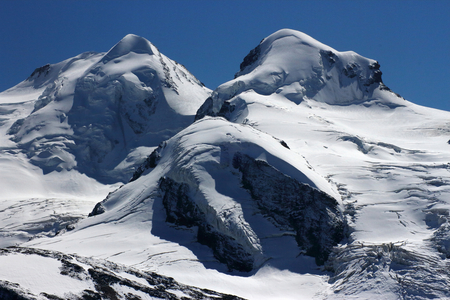 Castor (4223 meters) on the left and Pollux (4092 meters) on the right, in the Valais Alps on the border between the canton of Valais and the region of Valais d'Aosta, Switzerland, These two summits are named in reference to the Dioscurs of Greek mythology, 2019 (photo)