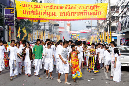 Thailand: Entranced devotees or 'Ma Song' and their assistants take part in a procession through Phuket Town, Phuket Vegetarian Festival
