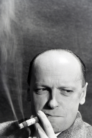 A man smoking a cigar for an advertising campaign, Germany 1930s (b/w photo)