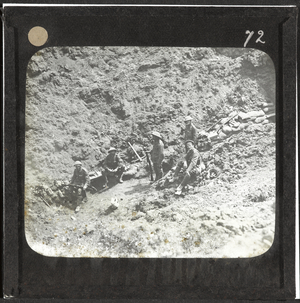British troops resting in a captured mine crater, July 1916 (lantern slide)