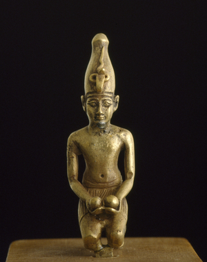 Statuette of king in the white crown offering two wine bowls (solid cast electrum)
