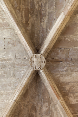 Monastery (Monestir de Poblet). The church. Interior. South aisle. The vaults. A keystone. An escutcheon.