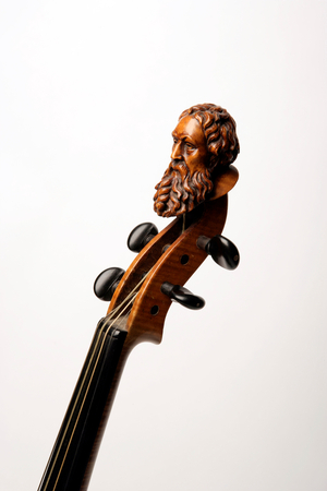 Carved head at the top of a violin scroll