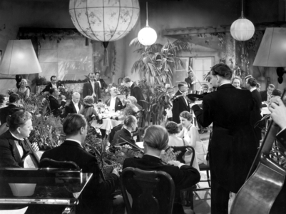 Guests in a dance cafe (b/w photo)