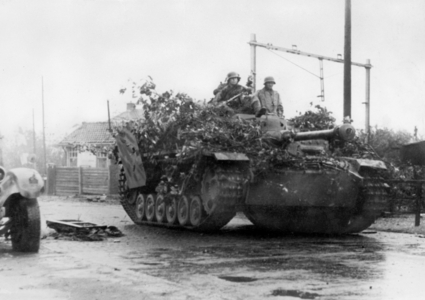 Soldiers on a German assault gun III in Silesia, 1945 (b/w photo)