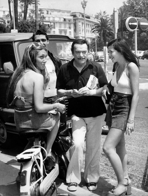 Eddie Constantine Singing his 2Nd Book The Winner in Cannes on The Riviera July 12, 1975 (b/w photo)