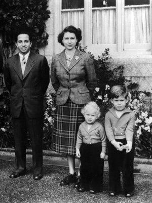 King Faysal II of Iraq during a visit to England with queen Elizabeth and children princess Ann and prince Charles September 26, 1952 (b/w photo)