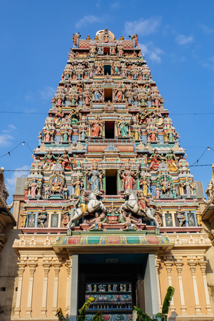 Thaipusam Festival: Colorful gopuram at the entrance to Hindu temple Sri Maha Mariamman in Kuala Lumpur, Malaysia.
