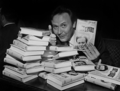 Maurice Biraud Signing his Book, April 5, 1966 (b/w photo)