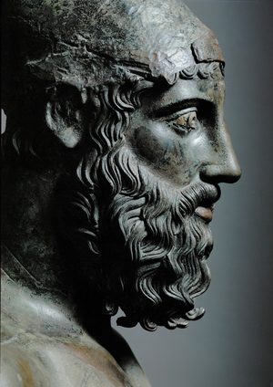 Head of bronze statue of a young man with helmet … (bronze)