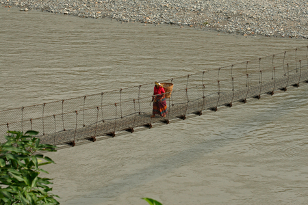 A woman on a suspension bridge (photo)