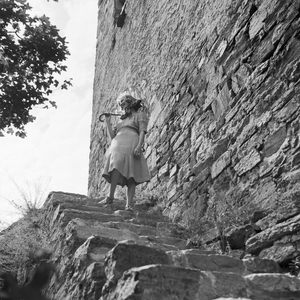 A young woman standing on a landmark's stairs in Austria, Germany 1930s (b/w photo)