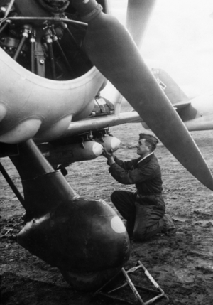 Examination of the bomb suspension of a dive bomber aircraft, 1939 (b/w photo)