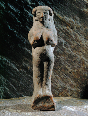 Woman with hands on breasts …