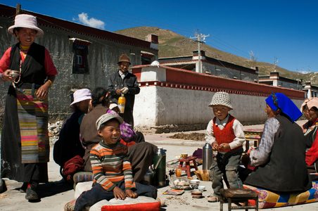 A family celebrates the graduation of a relative in the village of Bainans, located along the road separating Shigatse from Gyantse, Tibet, China (photo)