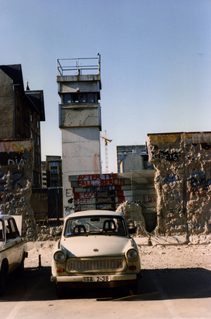 Partially demolished wall at Checkpoint Charlie, Berlin 1990 (photo)