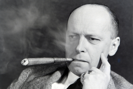 A man smoking a cigar for an advertising campaign, Germany 1930s (b/w photo)