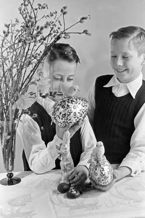 Two boys at a table with easter decoration, Germany 1930s (b/w photo)
