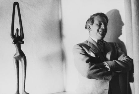 Art dealer Victor Waddington with Virgo statue by Irish sculptor Hilary Heron, 1967 (b/w photo)