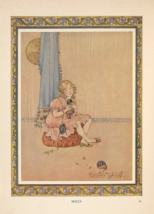 A young girl sitting on a cushion.