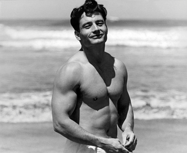 Body Builder At The Beach. (b/w photo)