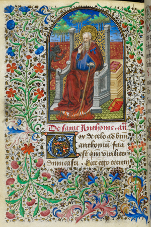 Miniature of Anthony, holding a tau-shaped staff and being tormented by a demon, with a full foliate border, at the beginning of his suffrage