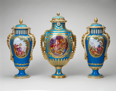 Garniture of three vases: (vase à Panneaux or vase à perles) and a pair of vases and covers (vase à bandes), 1771-77 (soft-paste porcelain, bleu céleste ground, gilded decoration and gilt bronze)