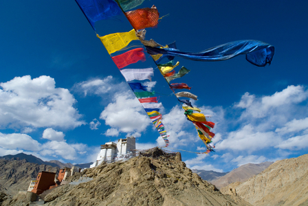 Tibetan Buddhism (Tantric B., Vajrayana): Two long lines of prayer flags stretching from one hill to Namgyal Tsemo Fort and Gompa (monastery) on another hill, Leh, Ladakh, Jammu and Kashmir, Himalayas, India (photo)