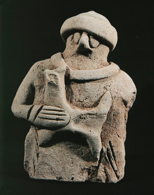 Shepherd carrying a lamb …