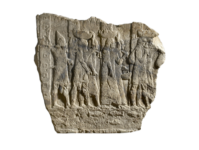 Fragment of Assyrian relief showing soldiers escorting loot and captives from Babylon (marble)
