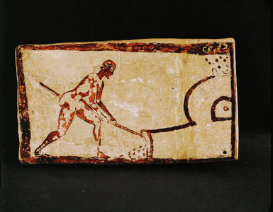 A potter stoking his oven …