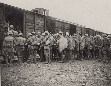 Men of a Midland Regiment boarding a train after fighting in the trenches of Flanders, 1914-18 (b/w photo)