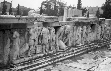 Tourist tour of the ruins of ancient Olympia here in the Dionysos theatre, Greece 1950s