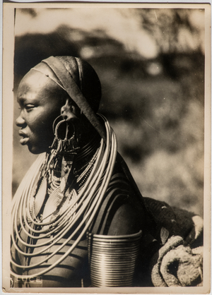 Portrait of woman of the Maasai tribe with showy ornaments around her neck, Africa, 1930 (photo)