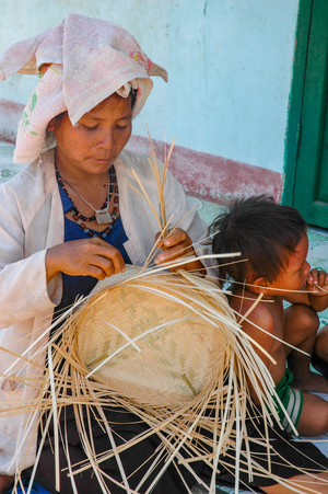 Cham culture: Cham woman weaving basket, village near Phan Rang, Vietnam.