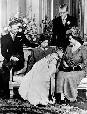 Princess Elizabeth with her son the prince of Wales Charles, in her arms, her father the king George VI of Great Britain and Irelandand her mother the queen Elizabeth and behind them her husband, Philip Mountbatten, duke of Edinburgh