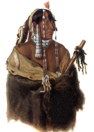 Mandeh-Pahchu, a young Mandan Indian holding a peace pipe and wearing bead and bone head tresses, engraving after drawing by Karl Bodmer made during expedition led by german traveller Maximilian zu Wied-Neuwied in North America to observe Indians (1832-1834)