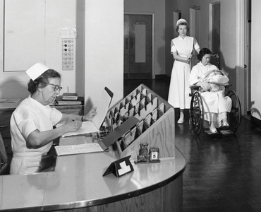 Two nurses and a patient with a baby, Northampton-Accomack Memorial Hospital, Nassawadox, Virginia, USA