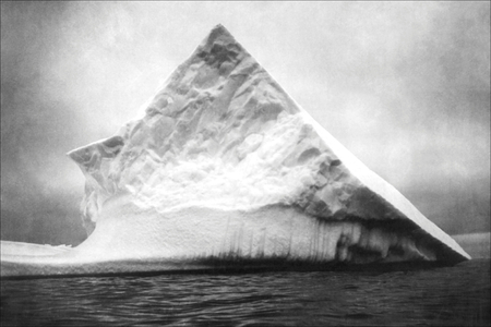 An iceberg near head of Trinity Bay, Newfoundland, 1900 (b/w photo)