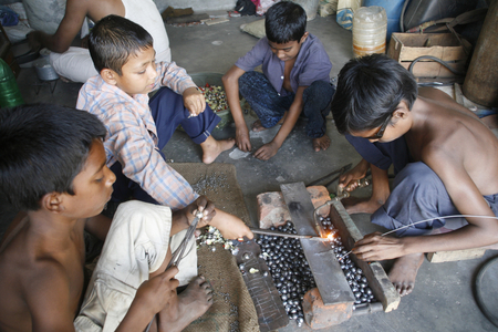 Children work at a welding shop in Shampur, Dhaka, Bangladesh. march 25, 2008.  (photo)