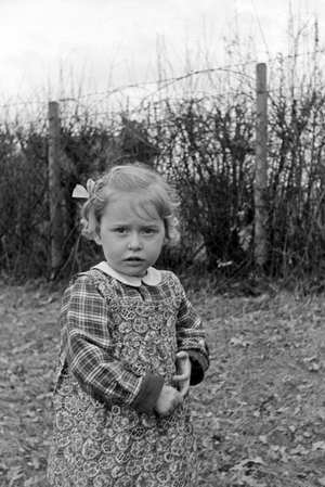 One of Knipser's quadruplet girls playing at the garden, Germany 1930s (b/w photo)