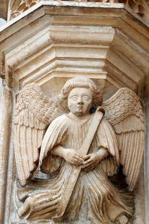 Batalha Monastery. Late Gothic architecture, intermingled with the Manueline style. Western portal. Angel. Portugal.
