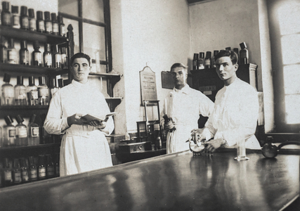 Three Pharmacists Posing in Laboratory, France, c.1905 (postcard)